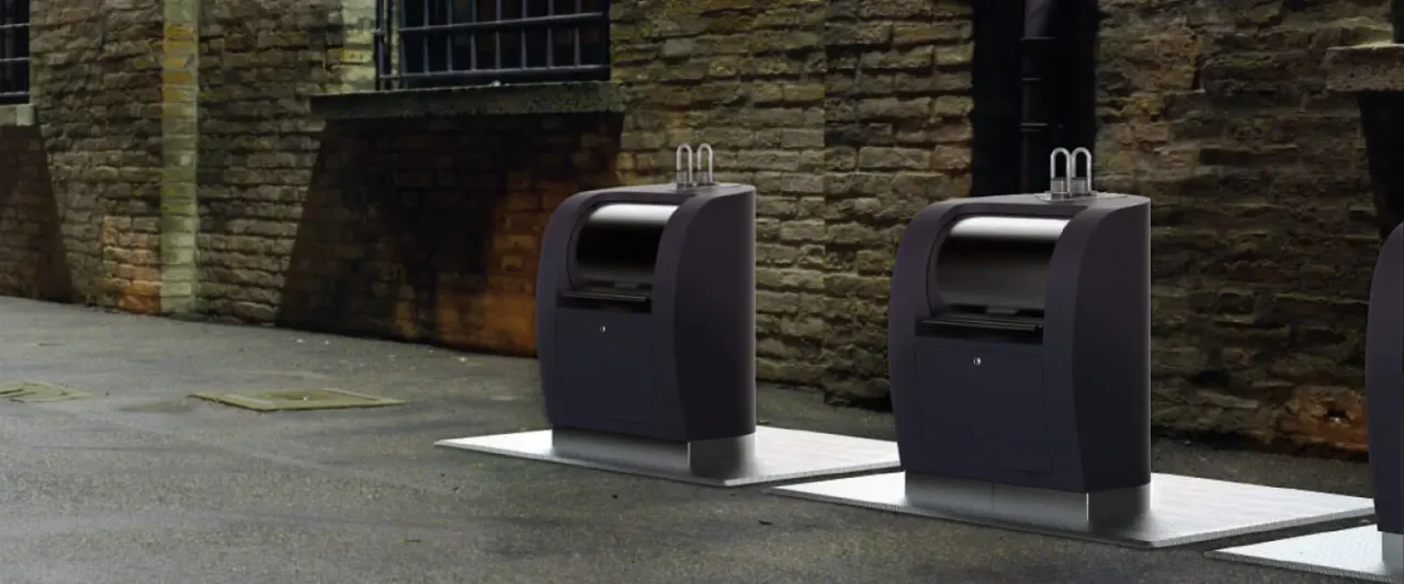 Underground bell-shaped waste containers installed in an urban recycling island