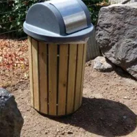 Semi-underground polyethylene litter bins, 200 L and 300 L, with wooden slat lid, particularly suited to woodland or mountain areas.